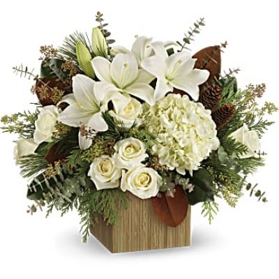 Give the gift of modern winter-white style with this breathtaking bouquet, hand-arranged in a wooden cube.

This winter bouquet includes white hydrangea, white roses, white asiatic lilies, magnolia leaves, seeded eucalyptus, spiral eucalyptus, flat cedar and white pine.