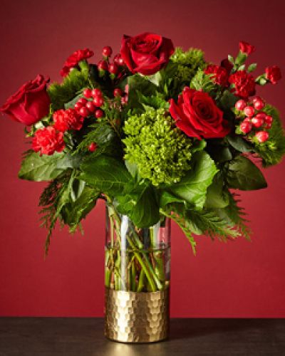 <p>Why wait to unwrap gifts till Christmas morning? Send yourself this breathtaking Home for the Holidays Bouquet and let the artistry of flowers surprise you. The gold-dipped vase matches the tinsel around the tree, creating nostalgia for decked halls in your childhood home.</p>