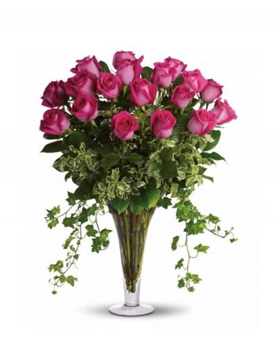 <p>Make her dreams come true with this vase full of vibrant, long-stemmed hot pink roses hand-arranged with ivy and other garden greens. Your dreams just might come true too.</p>
