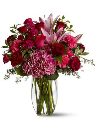 <p>Make a lovely lady blush with a generous mix of wine-hued blossoms such as roses, hydrangea, Asiatic lilies and more - in rich shades of burgundy, red and pink - delivered in a simple glass vase. With over half a dozen different varieties of flowers, it's a colorful and rare gift for any occasion. A mix of red, pink and burgundy flowers such as roses, Asiatic lilies, hydrangea, carnations and Sweet William – accented with greenery – is arranged in a clear glass vase.</p>