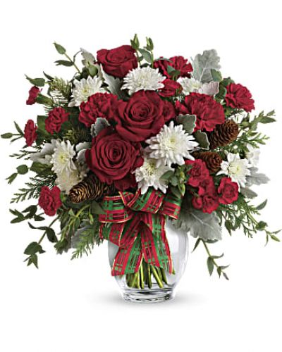 <p>Give the gift of holiday style with this mix of Christmas crimson and winter white blooms, all wrapped up with a festive plaid ribbon in a classic ginger jar.</p>