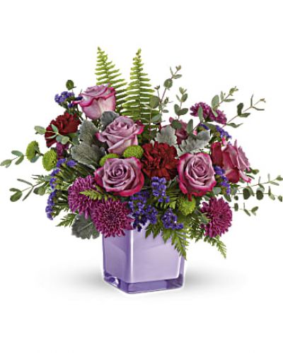 <div id="mark-3" class="m-pdp-tabs-marketing-description">A serene style statement in lush lavender roses and fresh maroon blooms, this rich bouquet in an amethyst-colored cube is a beautiful surprise for any occasion!</div>
<p> </p>
<div id="desc-3">
<ul>
<li>
<blockquote><p>Lavender roses, maroon carnations, purple cushion spray chrysanthemums, green button spray chrysanthemums, and purple sinuata statice are accented with sword fern, leatherleaf fern, dusty miller, and parvifolia eucalyptus.</p></blockquote>
</li>
</ul>
</div>