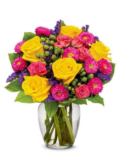Gushing with vibrant colors, this unique flower arrangement resembles the morning sky. Bright Happy Bouquet is sure to bring any home or office to life with its hot pinks, sweet yellows, pretty purples and its generous cascade of greens. This noteworthy flower arrangement is becomes even more special during the spring and summer months, as weather compliments its warmth.