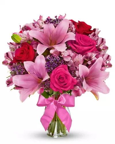 <p>Send stunning flowers to celebrate any occasion! With classic floral colors including red roses and pink lilies, the Rose and Lily Joy is a wonderful gift to send to a friend or family member for a birthday, get well or anniversary. The flowers are arranged by hand at a local florist shop. The floral artist creates the Rose and Lily bouquet with red roses, pink roses, pink lilies, pink alstroemeria and purple waxflower. Paired with the flowers is a keepsake clear vase that is wrapped in a decorative ribbon.</p>
<p><b>Includes:</b><br />
• Pink Asiatic Lilies<br />
• Pink and Red Roses<br />
• Purple Waxflowers<br />
• Alstroemeria<br />
• Glass Vase</p>