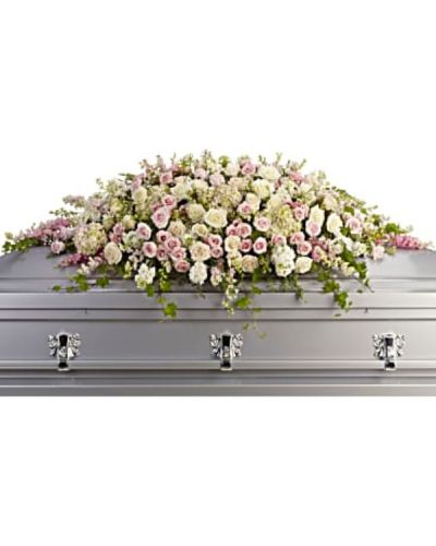 <div id="mark-1" class="m-pdp-tabs-marketing-description">A graceful and magnificent cascade of delicate pale pink, white, and crème flowers conveys everlasting affection for the radiant spirit being honored, and gently eases sorrow for those paying respect.</div>
<div id="desc-1">
<ul>
<li>Soft and feminine, this casket top display is composed of flowers such as pink hydrangea, roses and larkspur, along with white roses, stock and waxflower, accented by ivy, parvifolia eucalyptus and leatherleaf fern.</li>
</ul>
</div>