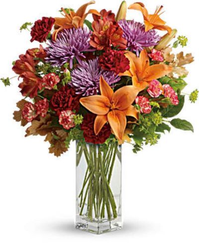 <div id="mark-3" class="m-pdp-tabs-marketing-description">Ring in the season with this fresh, colorful arrangement of lilies and alstroemeria. Hand-delivered in our beautifully crafted vase, it's an easy way to brighten anyone's day!</div>
<div id="desc-3">
<ul>
<li>This lovely bouquet includes orange asiatic lilies, dark orange alstroemeria, red carnations, orange miniature carnations, lavender disbud chrysanthemums, bupleurum, lemon leaf and oak leaves.</li>
</ul>
</div>