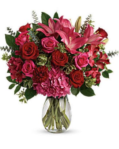 <div class="m-pdp-tabs-description">
<div id="mark-2" class="m-pdp-tabs-marketing-description">A luxurious bouquet that's sure to leave your special someone absolutely love struck! There's no denying the dramatic beauty of these radiant, red hot roses, hydrangea and lilies.</div>
</div>
<p id="arrngDescp">This luxe arrangement includes pink hydrangea, hot pink roses, red roses, dark pink asiatic lilies, dark pink alstroemeria, maroon carnations, pitta negra, spiral eucalyptus, and lemon leaf. Delivered in a glass jordan vase.</p>