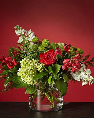 <p>WINTER BRIGHT BOUQUET<br />
Send season's greetings with our Winter Bright Bouquet and remind loved ones to find joy amongst the snowstorms. Let the green hydrangea blooms and red alstroemeria bring a slight botanical scent, while the warm red roses bring a classic holiday element.</p>